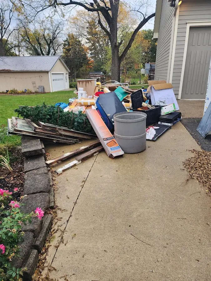 Dumpster being loaded with debris for 30 Yard Dumpster Rental in Wichita